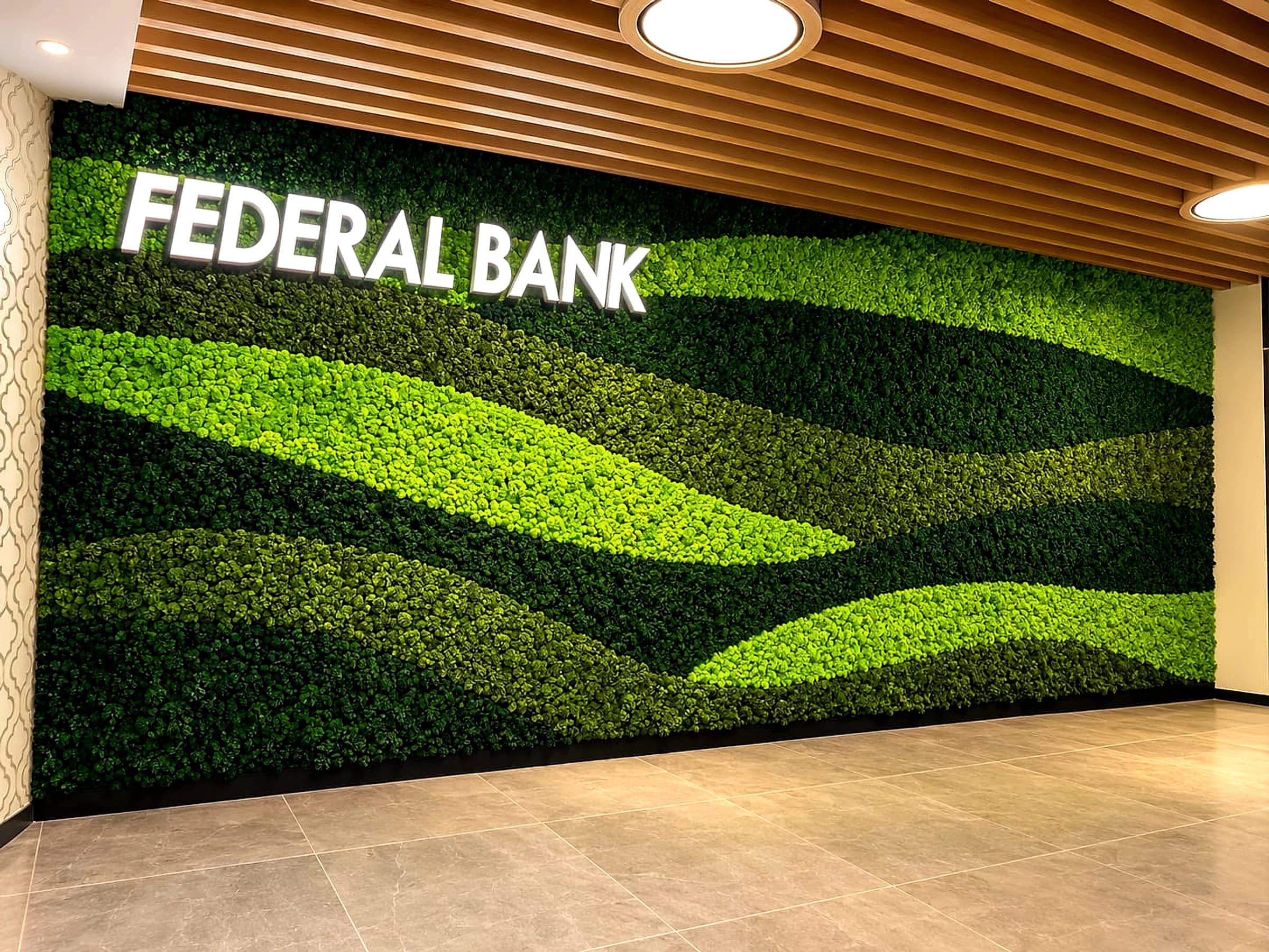 Federal Bank preserved moss wall feature with 3D backlit lettering